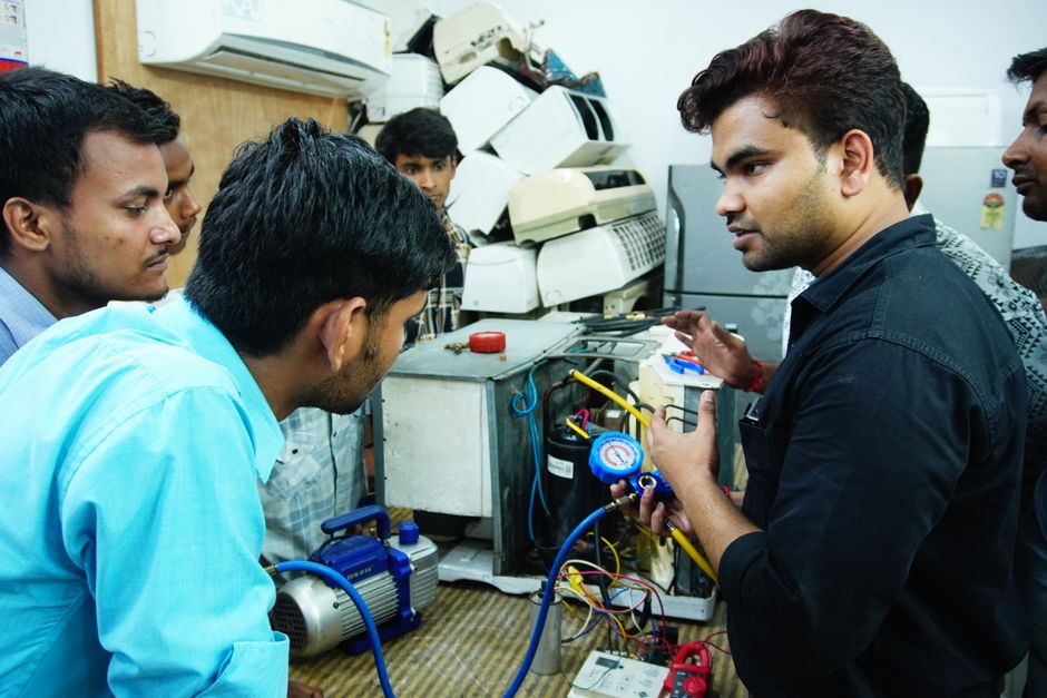 HVAC technician working on a unit